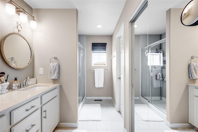 15205 W Baker Ave, Lakewood, CO 80228 - full bathroom with vanity, a stall shower, tile patterned floors, recessed lighting, and baseboards