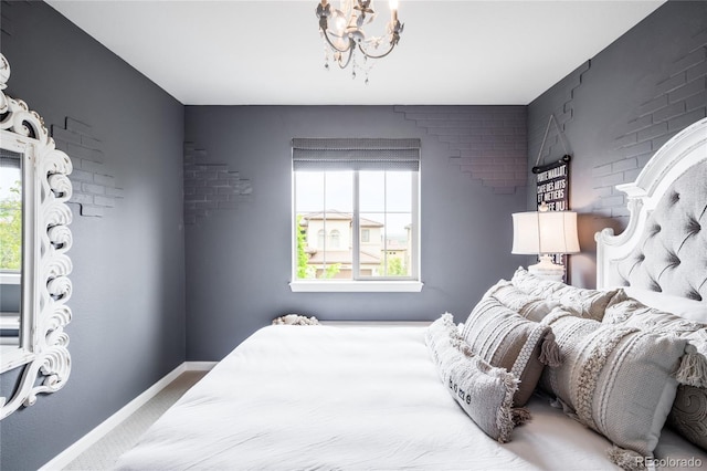 15205 W Baker Ave, Lakewood, CO 80228 - bedroom with baseboards, carpet floors, and a chandelier