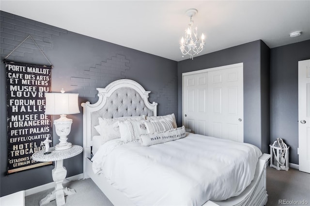 15205 W Baker Ave, Lakewood, CO 80228 - bedroom with carpet flooring, a chandelier, a closet, and baseboards