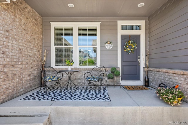 8677 S Buchanan Way, Aurora, CO 80016 - view of exterior entry featuring covered porch