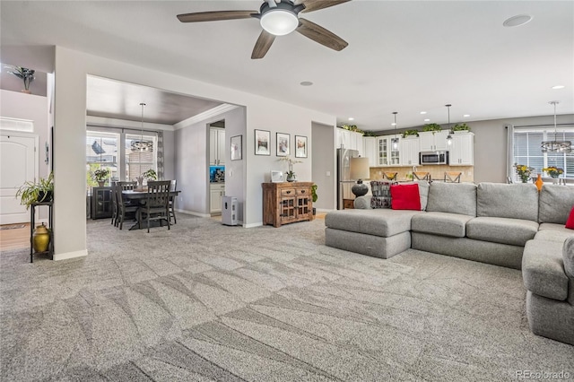 8677 S Buchanan Way, Aurora, CO 80016 - living room with ceiling fan, light colored carpet, and recessed lighting