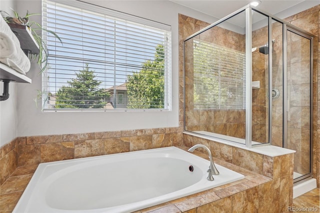 8677 S Buchanan Way, Aurora, CO 80016 - full bath with healthy amount of natural light, a bath, and a shower stall