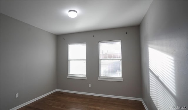 empty room featuring dark hardwood / wood-style floors