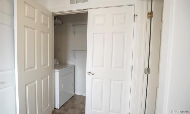 washroom with washer / dryer