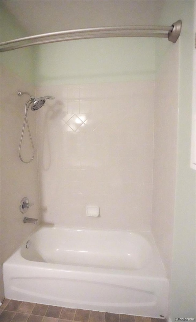 bathroom with shower / washtub combination