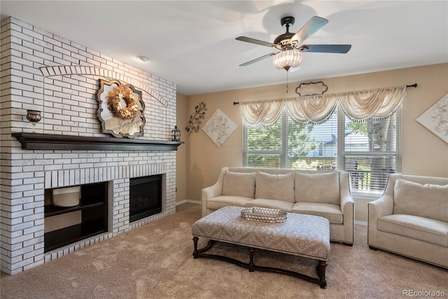 living room with ceiling fan, carpet flooring, and a brick fireplace