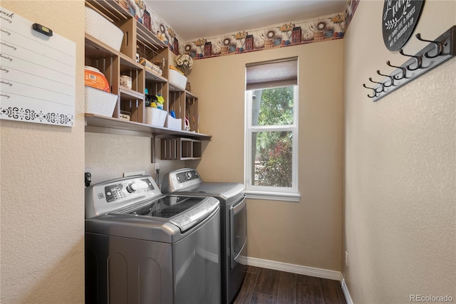 clothes washing area with dark wood-type flooring and washing machine and dryer