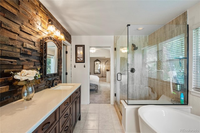 bathroom with vanity, shower with separate bathtub, and tile patterned flooring