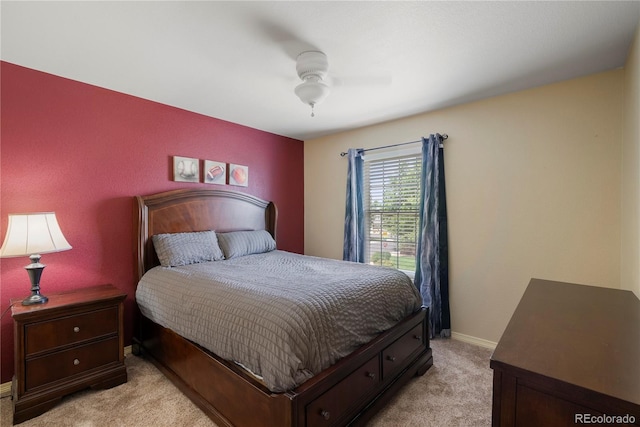 bedroom with ceiling fan and light carpet