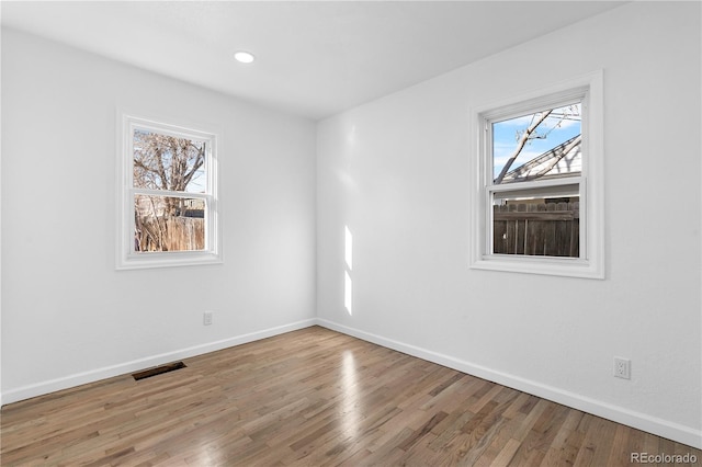 spare room featuring hardwood / wood-style flooring