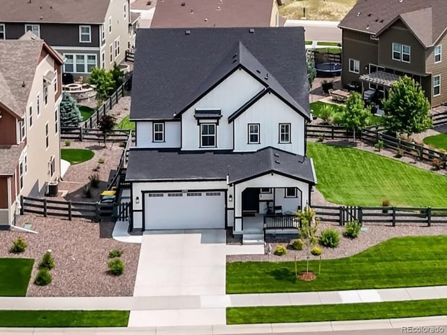 exterior space featuring a front lawn and a garage