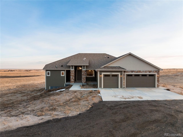 view of front of property with a garage