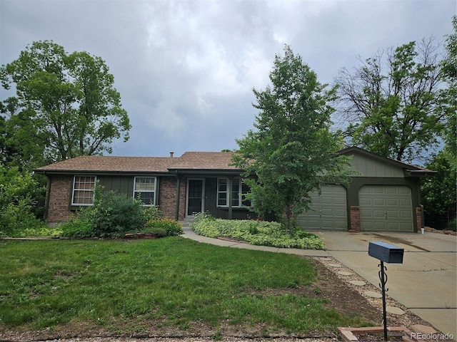 912 E 6th Ave, Broomfield, CO 80020 - single story home with driveway, brick siding, a front lawn, an attached garage, and board and batten siding