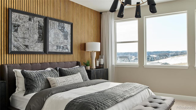 bedroom with wallpapered walls, carpet, and baseboards