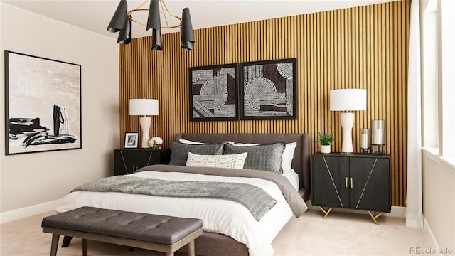 bedroom with carpet floors, a notable chandelier, and baseboards