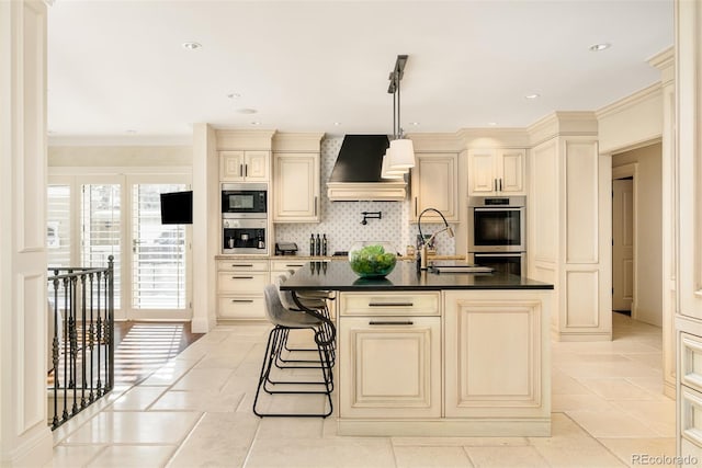 kitchen with double oven, built in microwave, tasteful backsplash, cream cabinets, and custom range hood