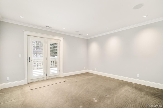 unfurnished room featuring carpet floors and ornamental molding