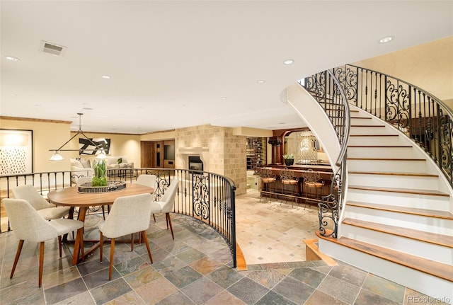 dining area with crown molding