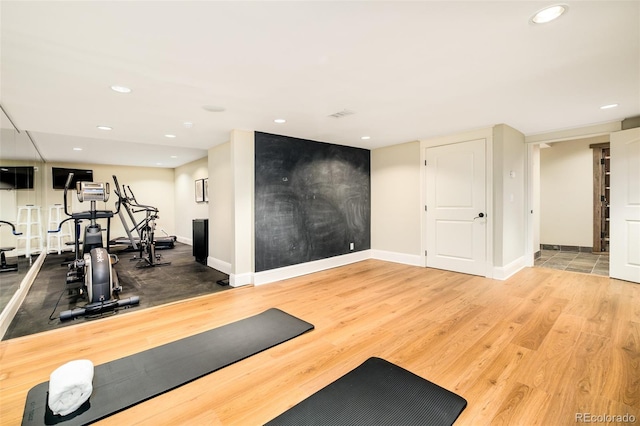 workout area featuring hardwood / wood-style floors