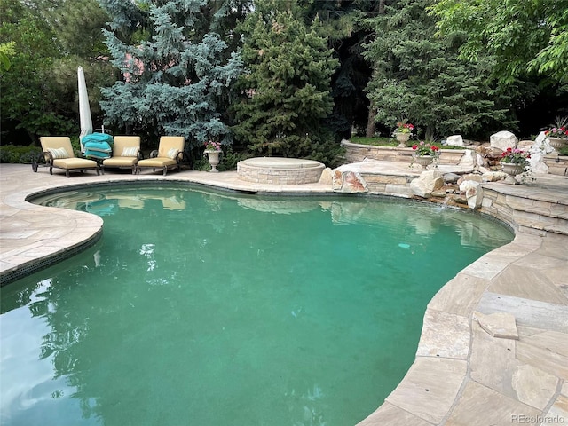 view of pool featuring a patio area