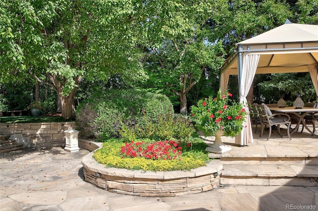 view of yard featuring a gazebo and a patio