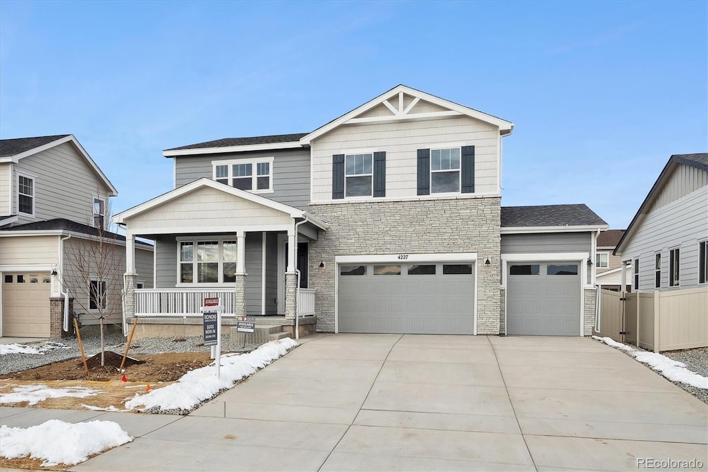 front of property with a porch and a garage