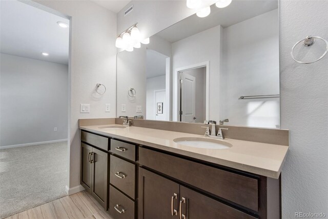 bathroom featuring vanity and wood-type flooring