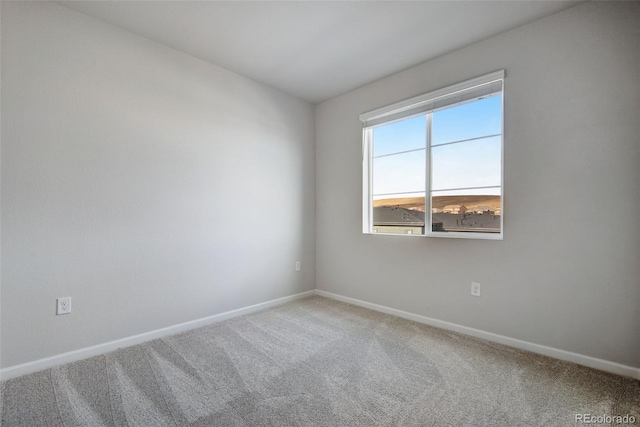 unfurnished room featuring carpet flooring