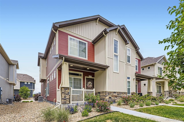 17855 E 103rd Ave, Commerce City, CO 80022 - craftsman house with covered porch, central air condition unit, stone siding, and board and batten siding