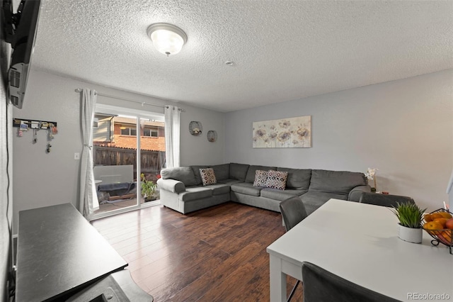 8059 Wolff St Unit C, Westminster, CO 80031 - living area featuring dark wood-style flooring and a textured ceiling