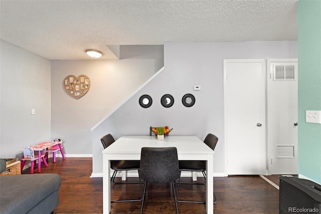 8059 Wolff St Unit C, Westminster, CO 80031 - dining space with dark wood-style floors and a textured ceiling
