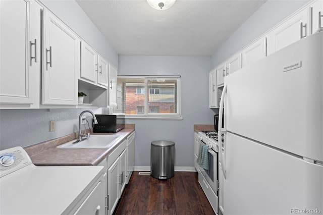 8059 Wolff St Unit C, Westminster, CO 80031 - kitchen featuring white appliances, washer / dryer, dark wood-style flooring, white cabinets, and light countertops
