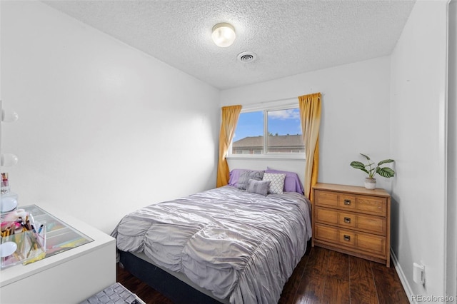 8059 Wolff St Unit C, Westminster, CO 80031 - bedroom with a textured ceiling and wood finished floors