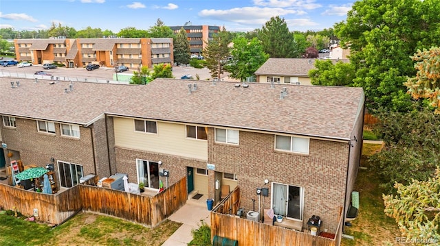 8059 Wolff St Unit C, Westminster, CO 80031 - back of house featuring brick siding and a shingled roof