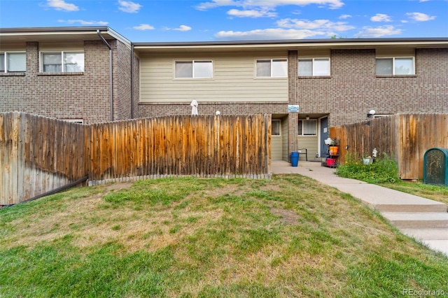 8059 Wolff St Unit C, Westminster, CO 80031 - back of property with a fenced backyard and brick siding
