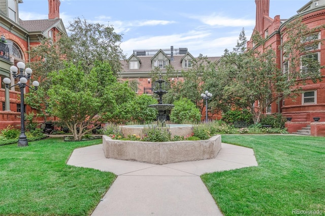 view of home's community featuring a lawn