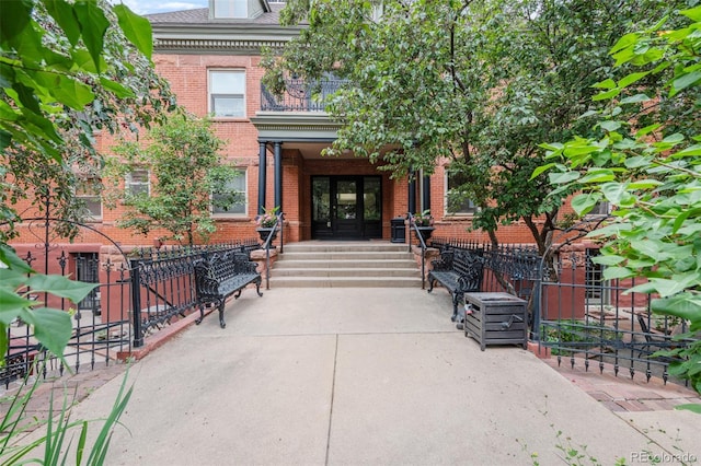 view of exterior entry featuring french doors