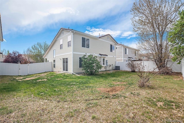 view of property exterior with a lawn, a gate, a fenced backyard, and cooling unit