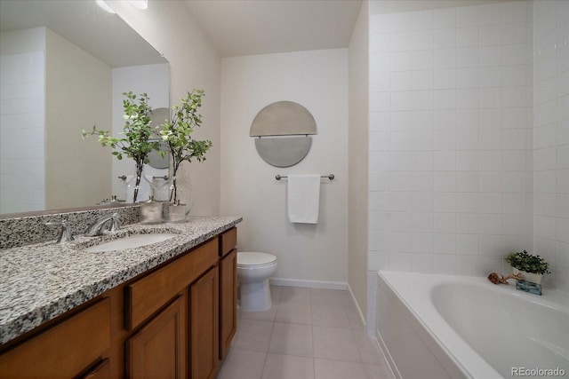 bathroom with vanity, a tub to relax in, tile patterned floors, and toilet