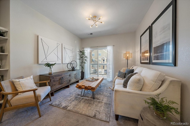 1841 S Dunkirk St Unit 203, Aurora, CO 80017 - carpeted living room with a chandelier