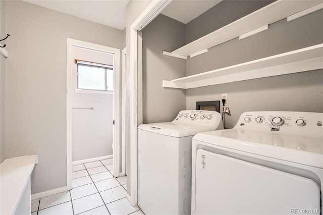 18984 E Kent Cir, Aurora, CO 80013 - laundry room featuring washing machine and clothes dryer, light tile patterned flooring, and baseboards