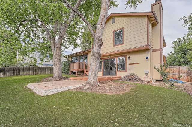 18984 E Kent Cir, Aurora, CO 80013 - rear view of house with a chimney and a patio area