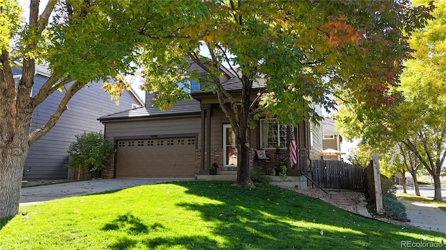 obstructed view of property with a garage, driveway, brick siding, and a front lawn