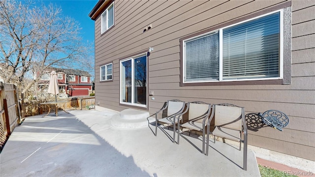 view of patio / terrace featuring fence