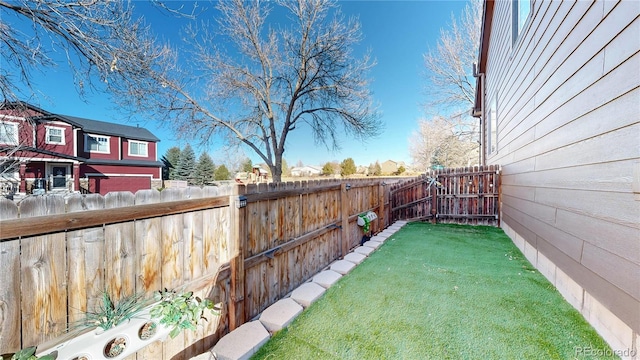 view of yard featuring a fenced backyard