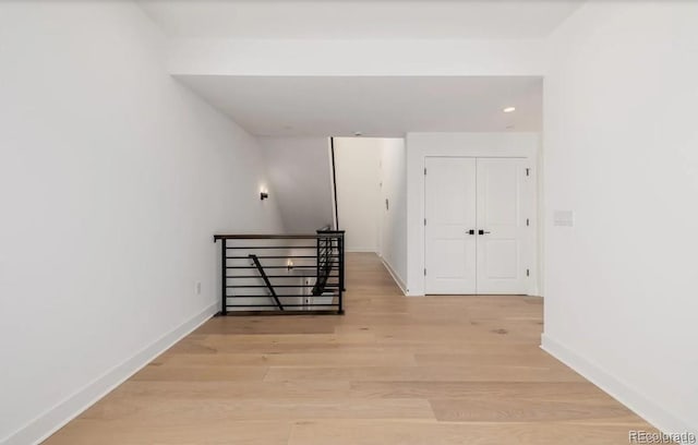 2361 Junegrass Ln, Superior, CO 80027 - hall with an upstairs landing, light wood-type flooring, baseboards, and recessed lighting