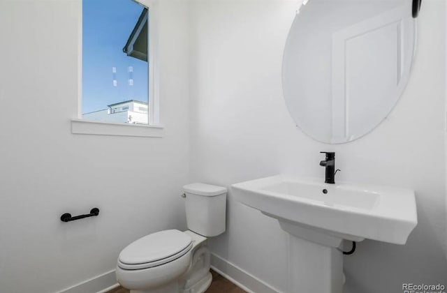 2361 Junegrass Ln, Superior, CO 80027 - half bathroom with baseboards and toilet