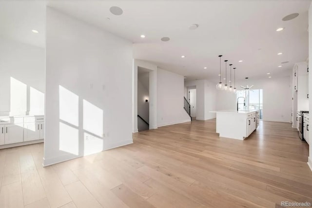 2361 Junegrass Ln, Superior, CO 80027 - unfurnished living room featuring light wood-style floors, recessed lighting, and baseboards