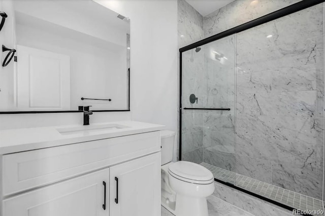 2361 Junegrass Ln, Superior, CO 80027 - full bath with toilet, a marble finish shower, and vanity