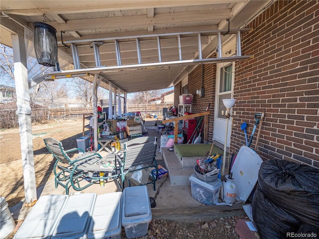 view of patio / terrace featuring fence